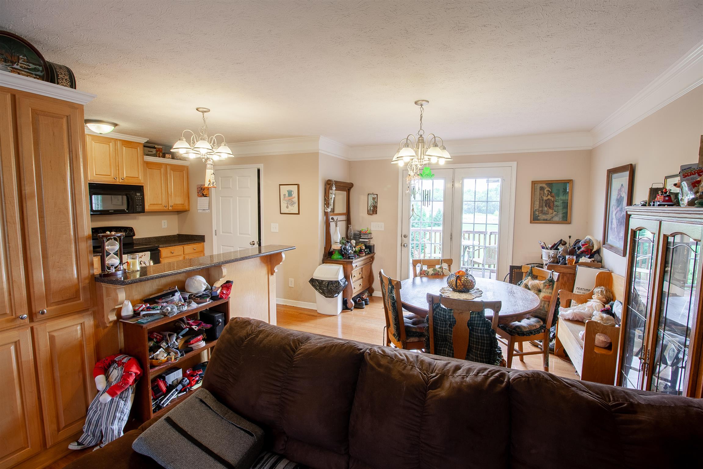 183 Shuab Road Portland, TN 37148 - Photo 14 of 25 a living room with lots of furniture and chandelier