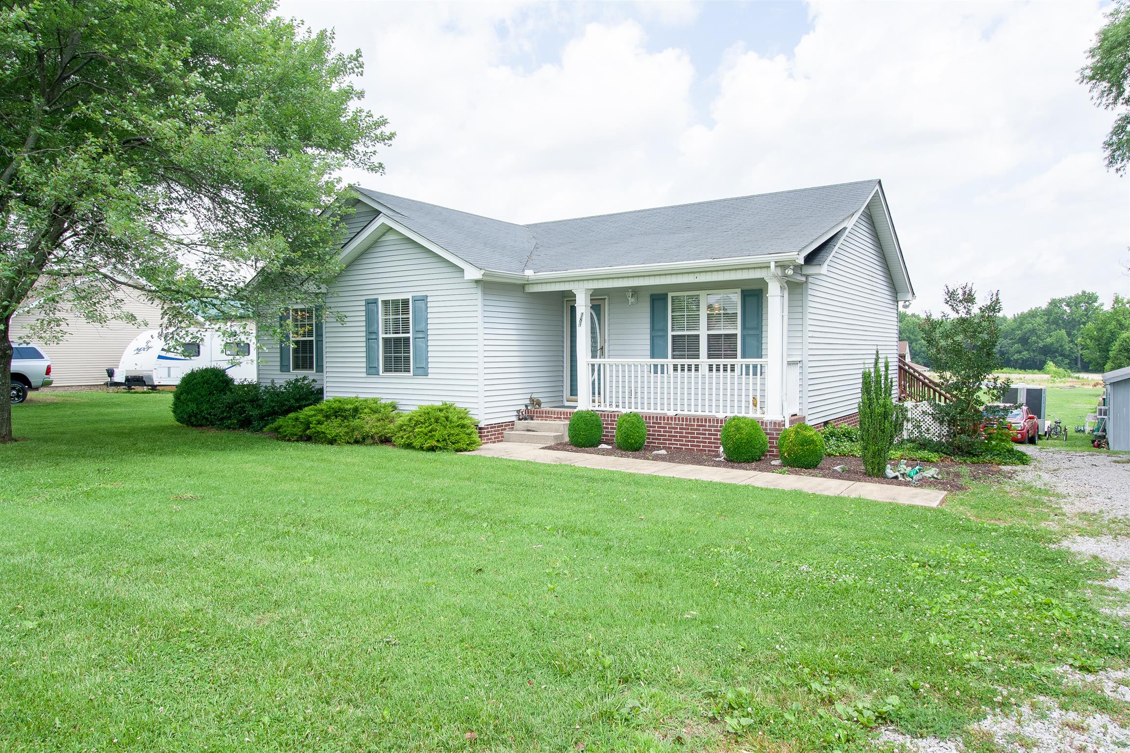 183 Shuab Road Portland, TN 37148 - Photo 3 of 25 a front view of house with yard and green space