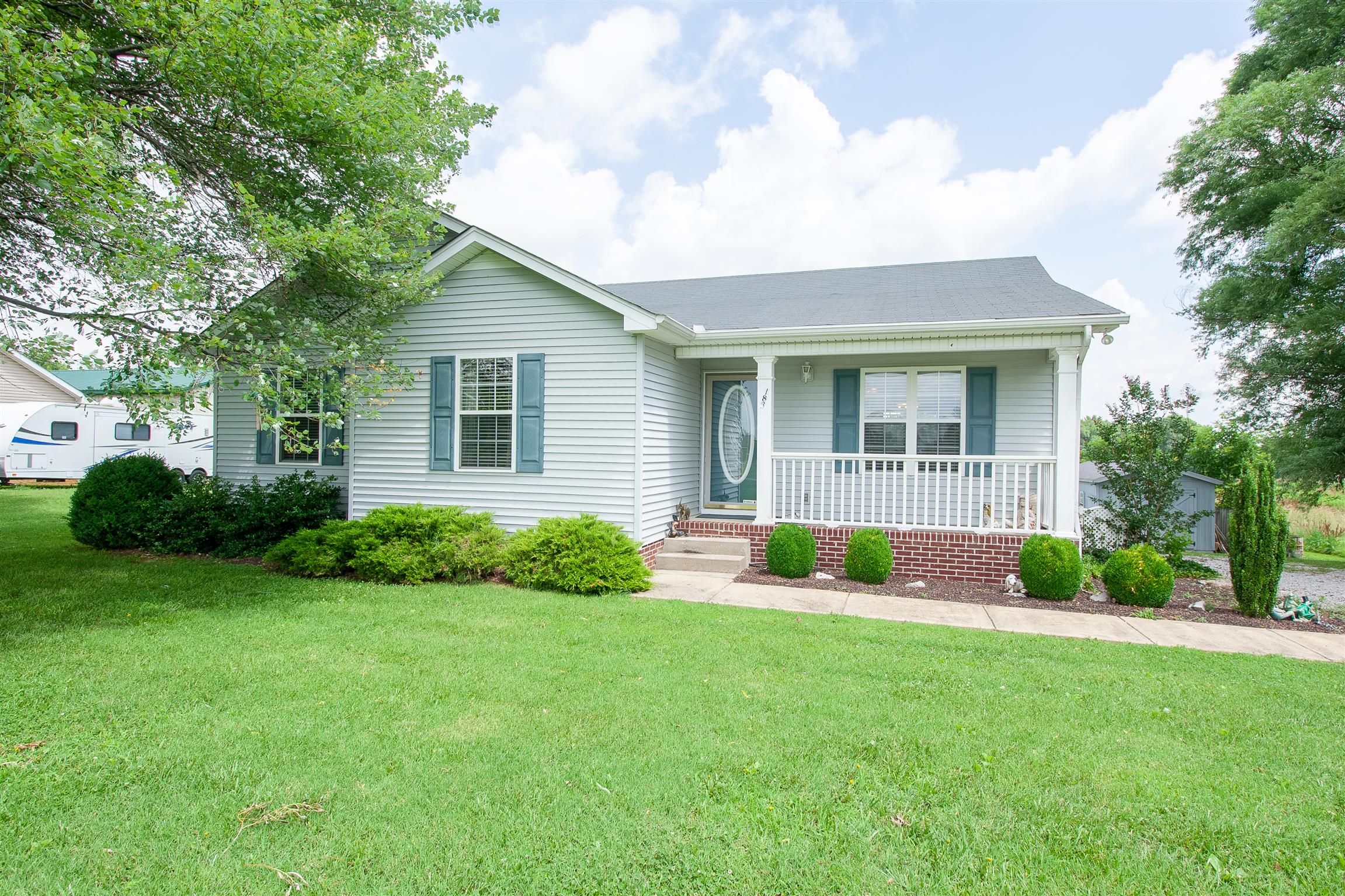 183 Shuab Road Portland, TN 37148 - Photo 4 of 25 a front view of house with yard and green space