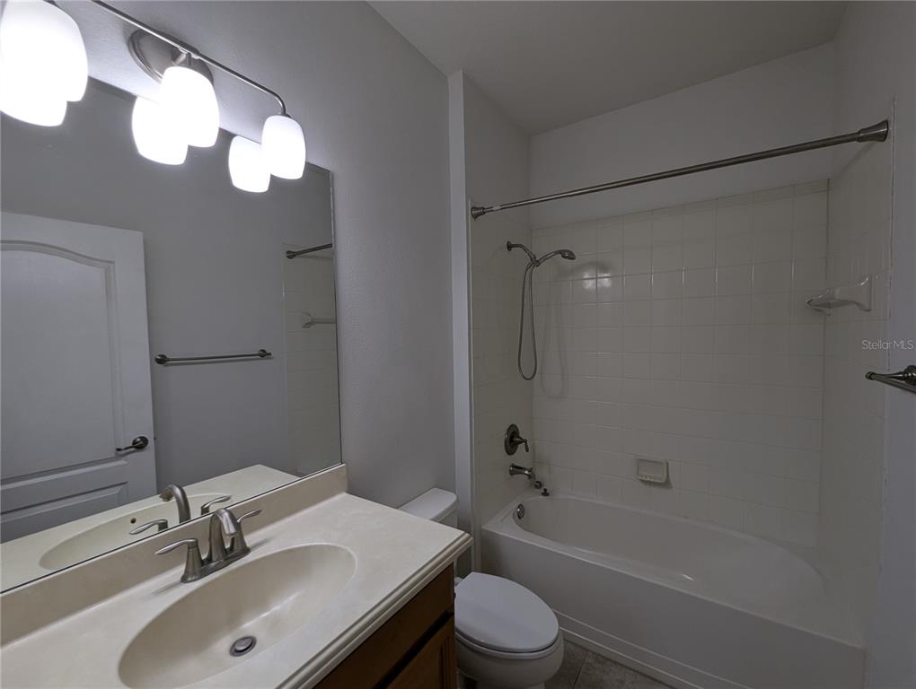 13428 Graham Yarden Drive Riverview, FL 33579 - Photo 11 of 15 a bathroom with a sink a toilet and shower