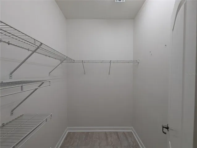 a view of a room with racks on the wall