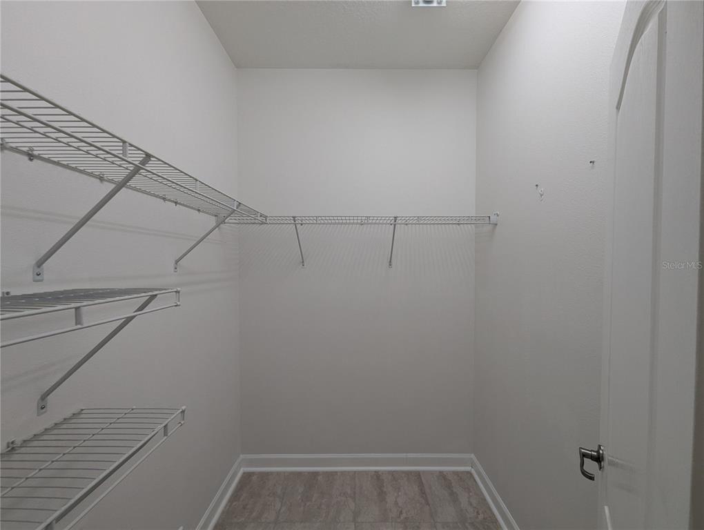 13428 Graham Yarden Drive Riverview, FL 33579 - Photo 8 of 15 a view of a room with racks on the wall