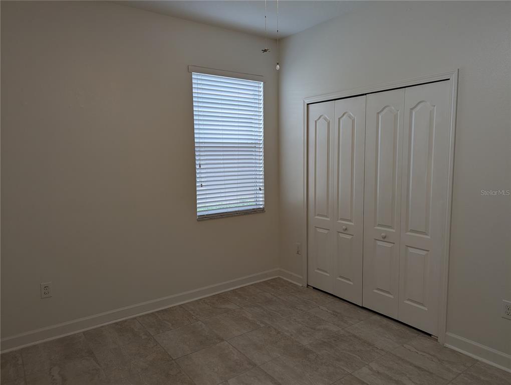 13428 Graham Yarden Drive Riverview, FL 33579 - Photo 10 of 15 an empty room with a window