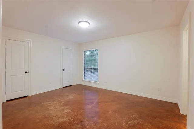 a view of an empty room and window