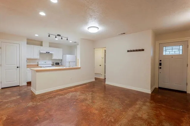 a view of kitchen with wooden floor