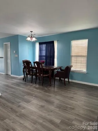a view of a livingroom with furniture and windows