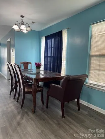 a room with furniture lamps and wooden floor