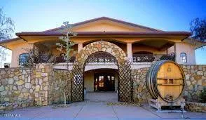 a front view of the house with outdoor seating