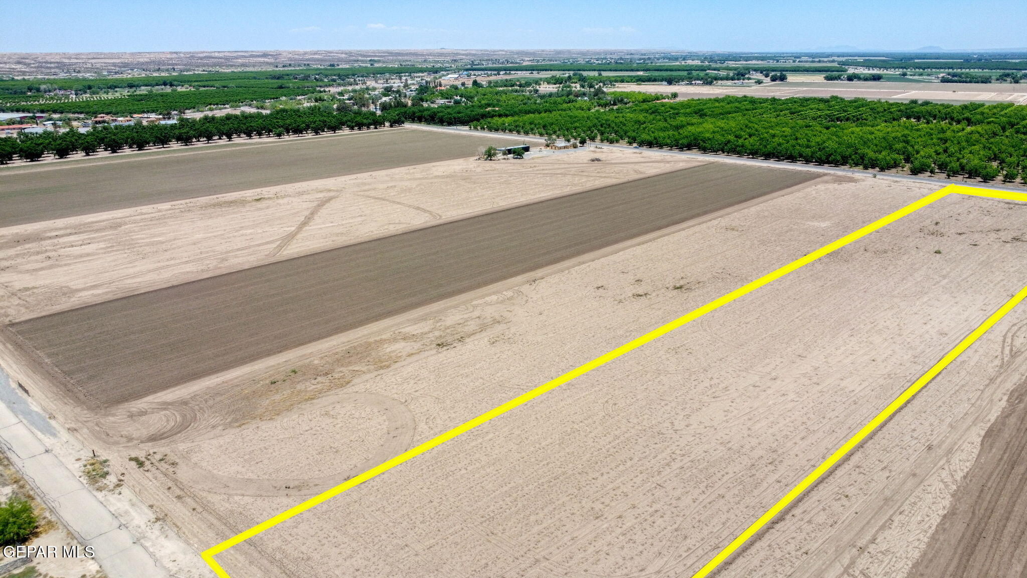 7038 McNutt Road Anthony, NM 88021 - Photo 10 of 21 a view of a swimming pool with a yard and ocean view