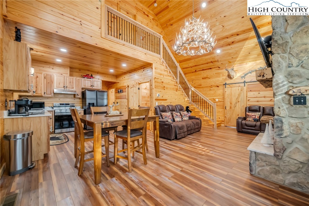 2533 Buck Mountain Road Purlear, NC 28665 - Photo 11 of 40 a dining room with furniture and wooden floor