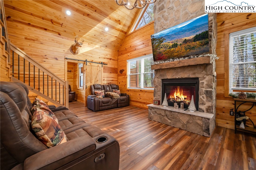 2533 Buck Mountain Road Purlear, NC 28665 - Photo 12 of 40 a living room with furniture and a fireplace