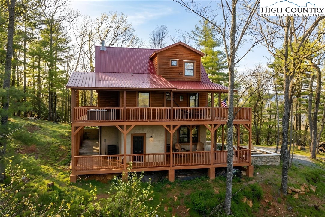 2533 Buck Mountain Road Purlear, NC 28665 - Photo 2 of 40 a front view of a house with garden
