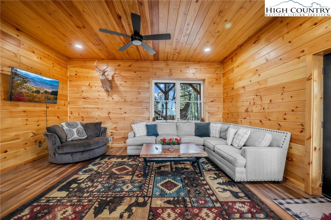 2533 Buck Mountain Road Purlear, NC 28665 - Photo 24 of 40 a living room with furniture and a flat screen tv