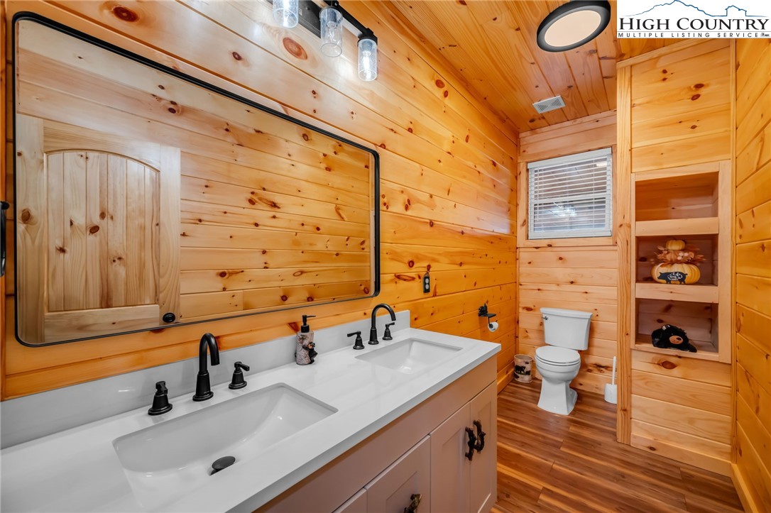2533 Buck Mountain Road Purlear, NC 28665 - Photo 28 of 40 a bathroom with a sink and a mirror