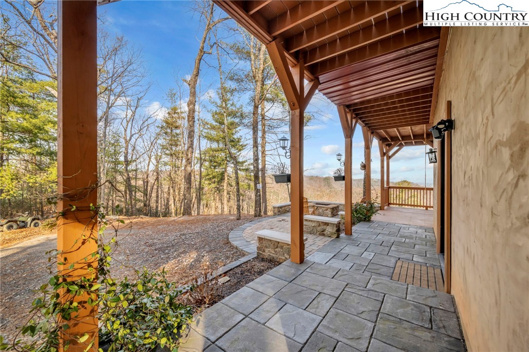 2533 Buck Mountain Road Purlear, NC 28665 - Photo 4 of 40 a view of porch with a table and chairs