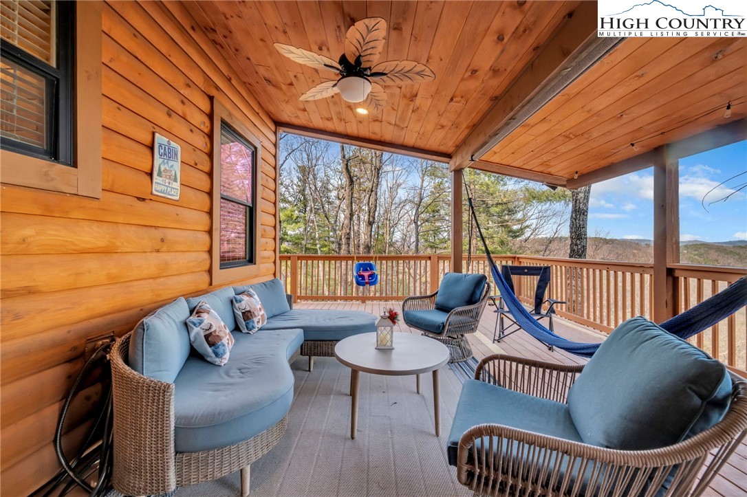 2533 Buck Mountain Road Purlear, NC 28665 - Photo 9 of 40 a outdoor living room with furniture and a window