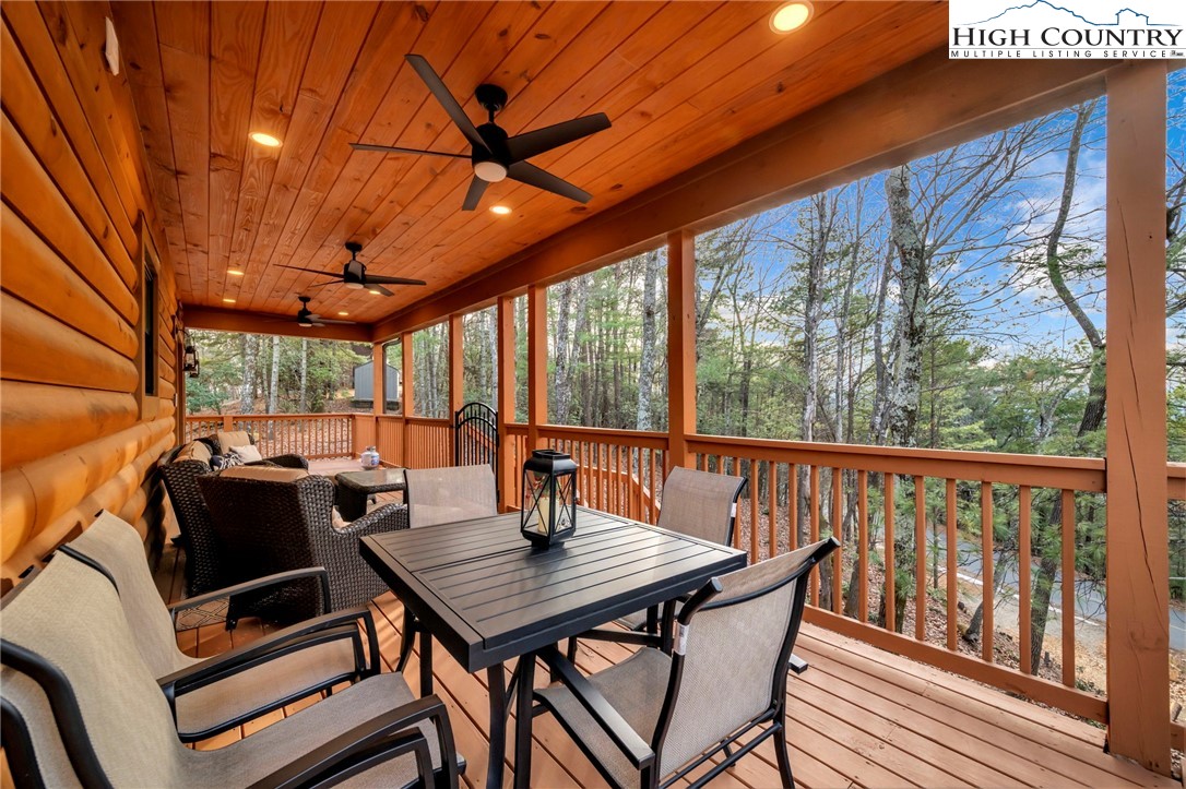 2533 Buck Mountain Road Purlear, NC 28665 - Photo 10 of 40 a view of a patio with a table chairs and a backyard