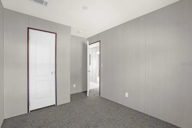 an empty room with closet area