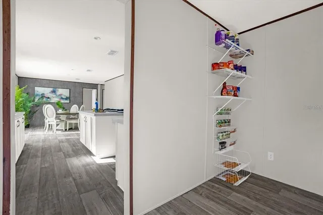 a view of entryway with workspace and wooden floor