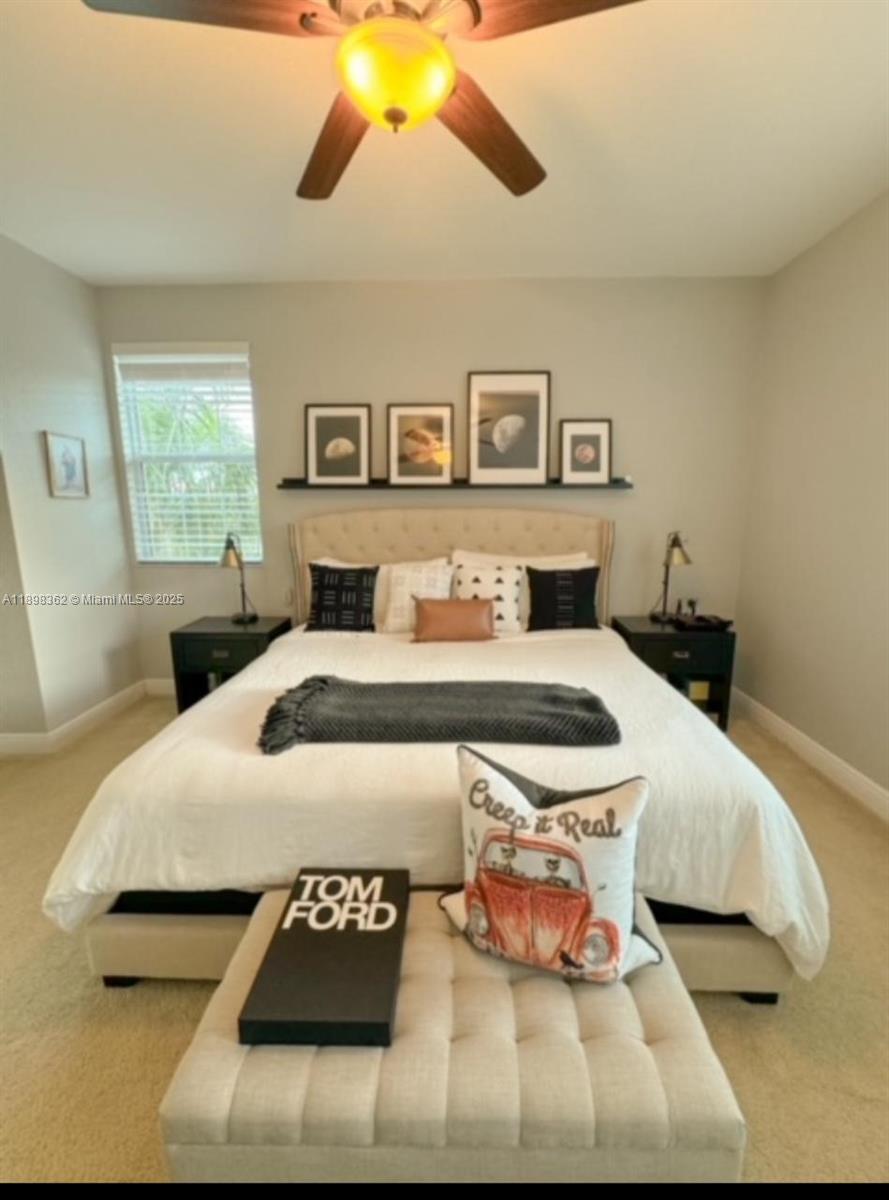 1006 Southwest 147th Avenue, Unit 10601 Pembroke Pines, FL 33027 - Photo 1 of 38 a bedroom with a bed and a night stand