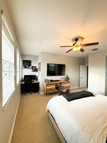 a spacious bathroom with a double vanity sink a mirror and a shower