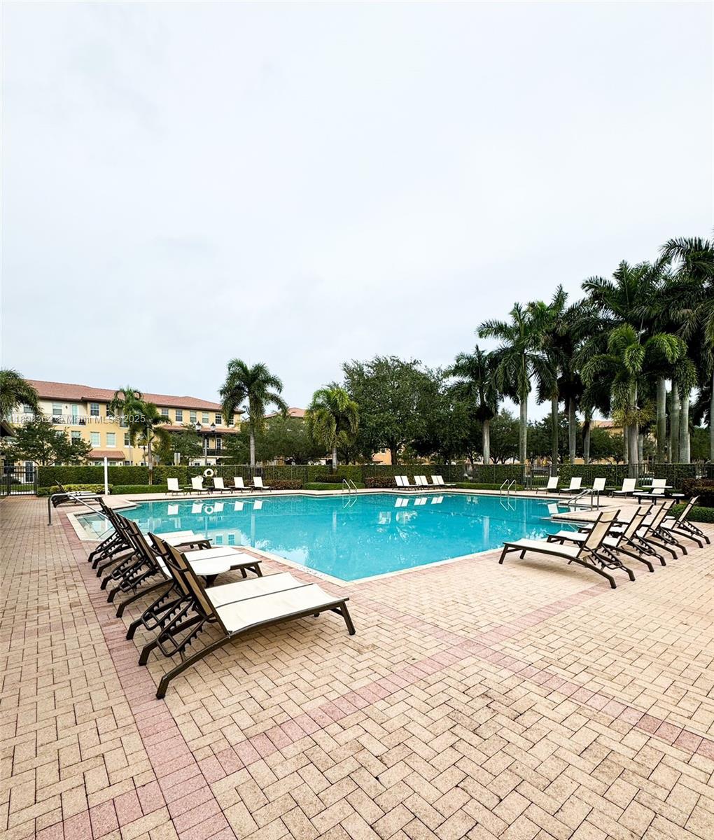 1006 Southwest 147th Avenue, Unit 10601 Pembroke Pines, FL 33027 - Photo 36 of 38 a view of swimming pool with lounge chair