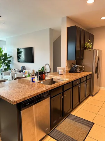 a bathroom with a sink double vanity granite and a mirror