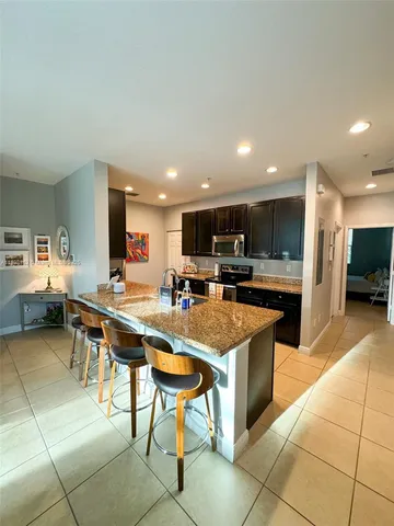 a kitchen with stainless steel appliances lots of counter top space