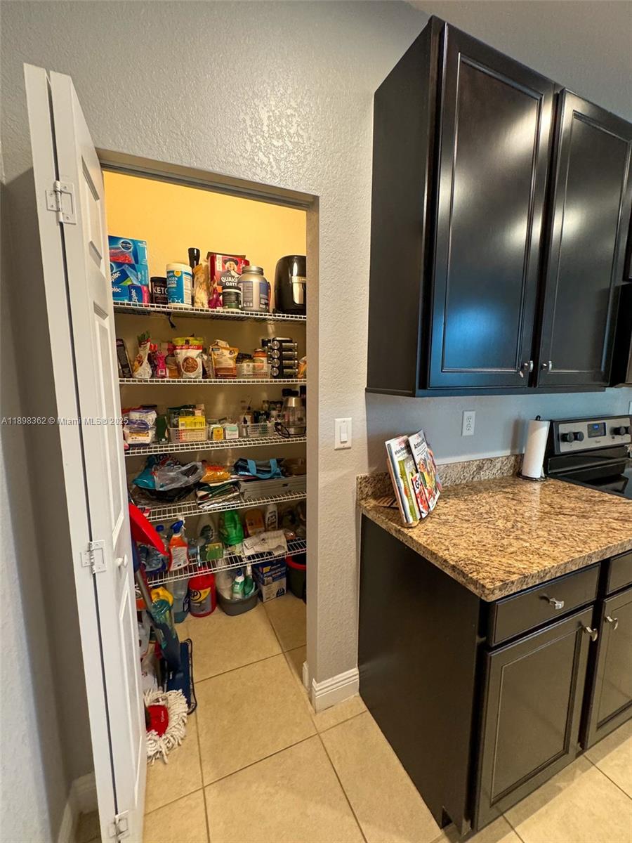 1006 Southwest 147th Avenue, Unit 10601 Pembroke Pines, FL 33027 - Photo 9 of 38 a room with storage and utility