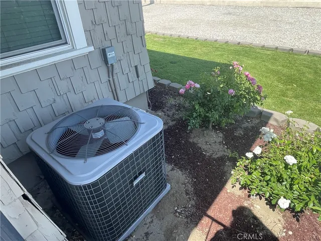 a view of a backyard with plants and patio