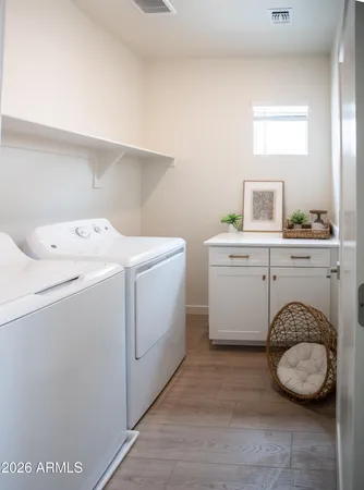 a utility room with dryer and washer