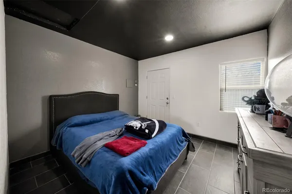 a bedroom with a bed and a closet