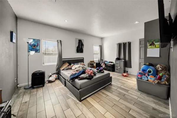 a living room with furniture fireplace and flat screen tv