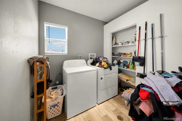 a view of a room with workspace and a window
