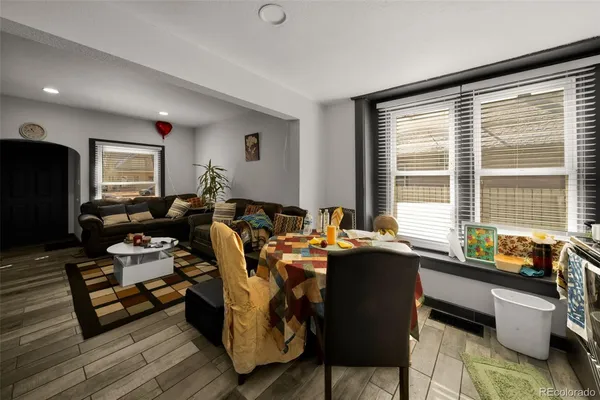 a view of a dining room with furniture window and wooden floor