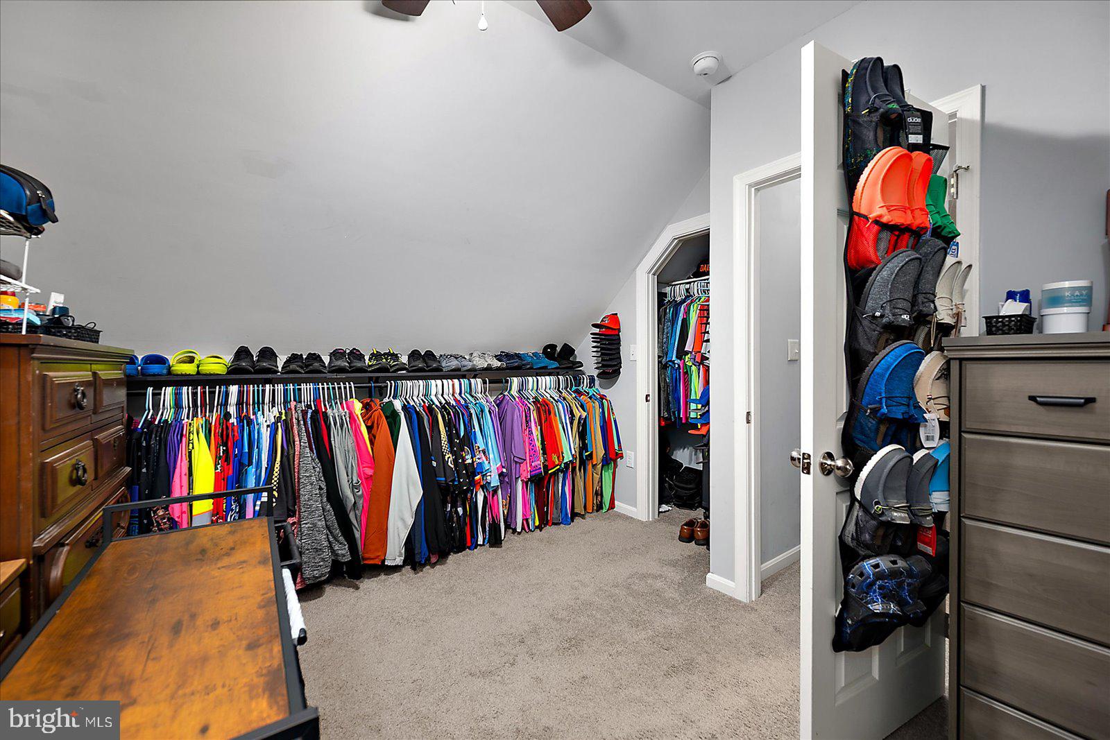411 East Walnut Street Hebron, MD 21830 - Photo 25 of 54 a view of walk in closet with clothes and shoes