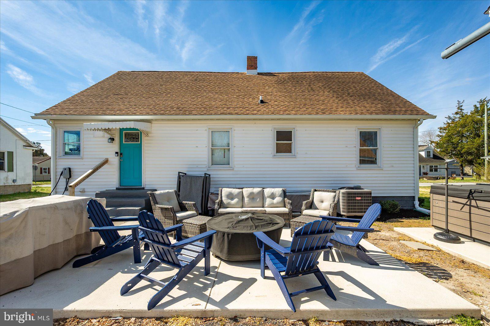 411 East Walnut Street Hebron, MD 21830 - Photo 45 of 54 a view of a patio with table and chairs with wooden floor
