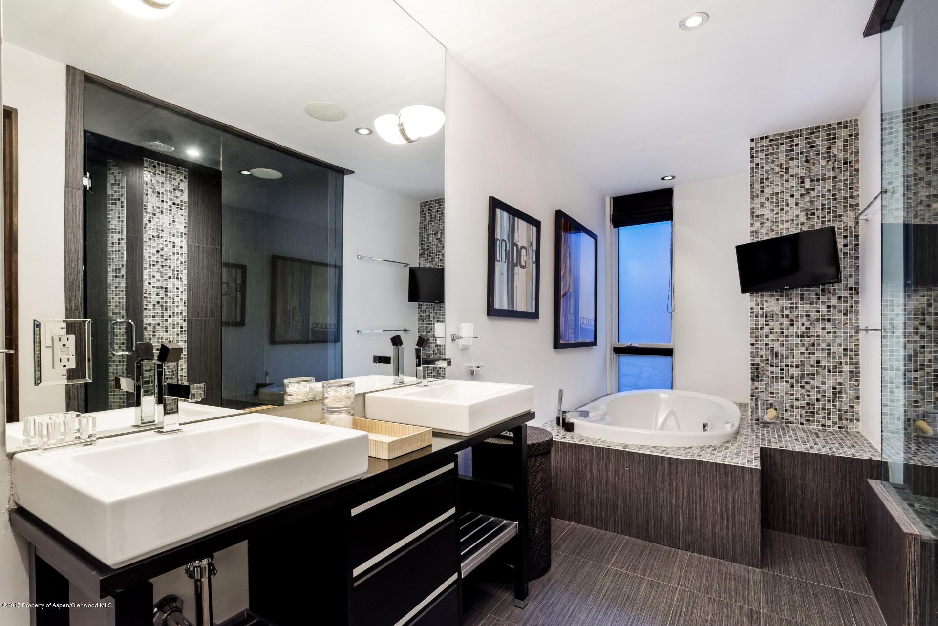 342 Summit Street, Unit B Aspen, CO 81611 - Photo 15 of 31 a bathroom with a sink double vanity and a mirror
