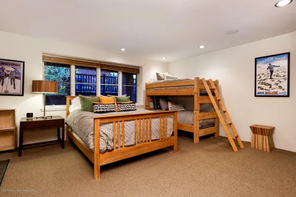a bedroom with furniture and window