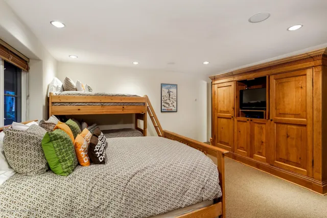 a bed room with furniture and a window