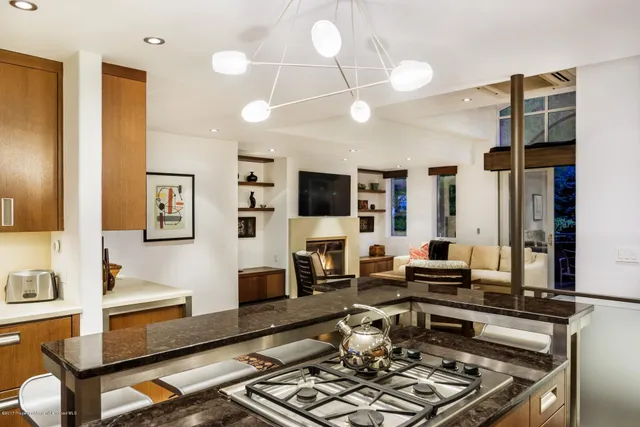 a living room with fireplace furniture and a flat screen tv