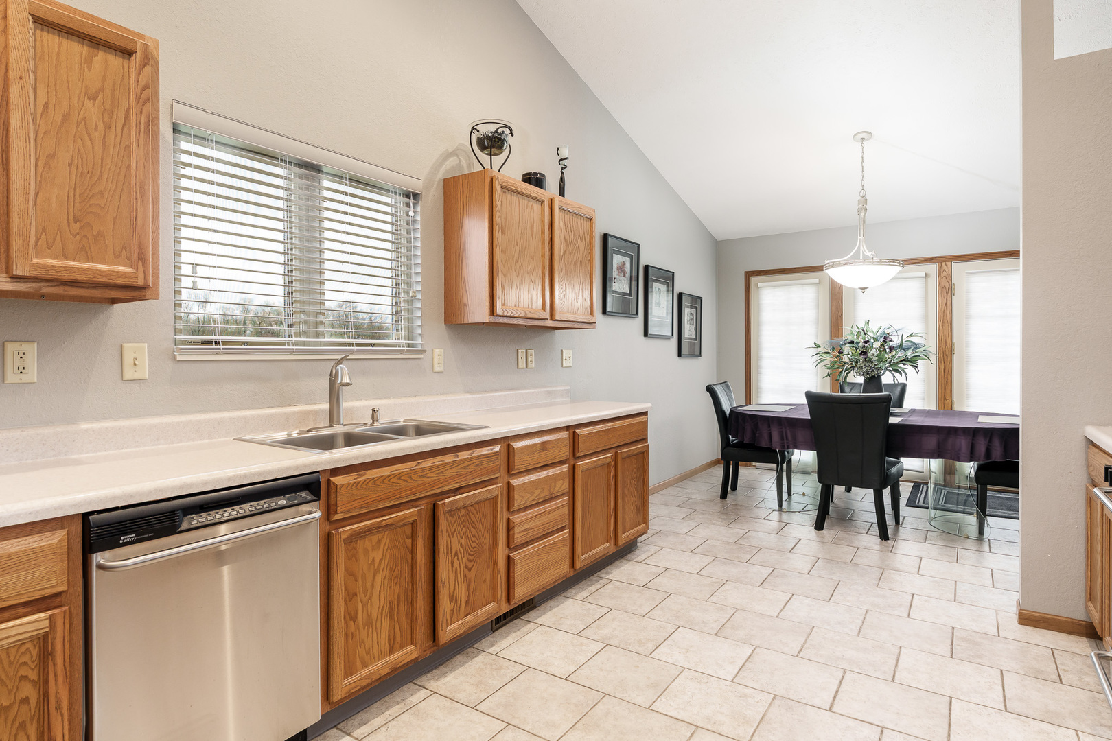 6465 Corina's Curve Rockford, IL 61103 - Photo 17 of 48 a kitchen with sink dining table and chairs