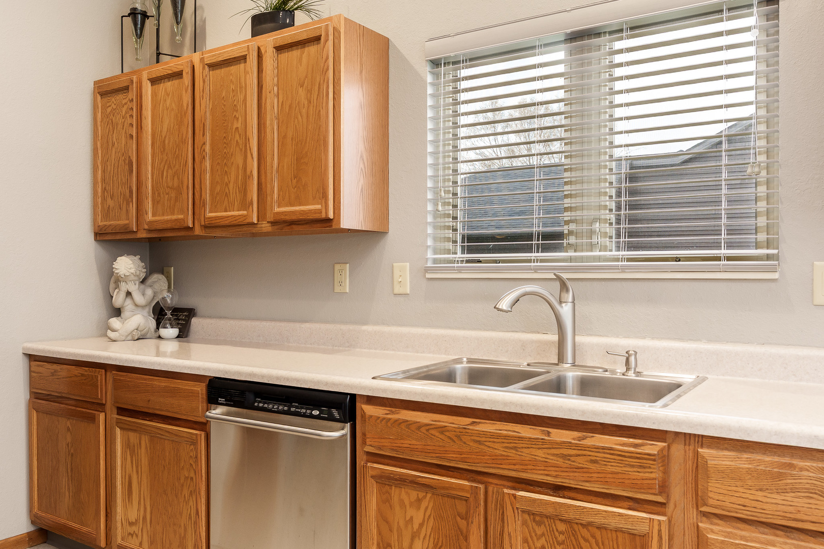 6465 Corina's Curve Rockford, IL 61103 - Photo 19 of 48 a kitchen with stainless steel appliances granite countertop a sink and a window