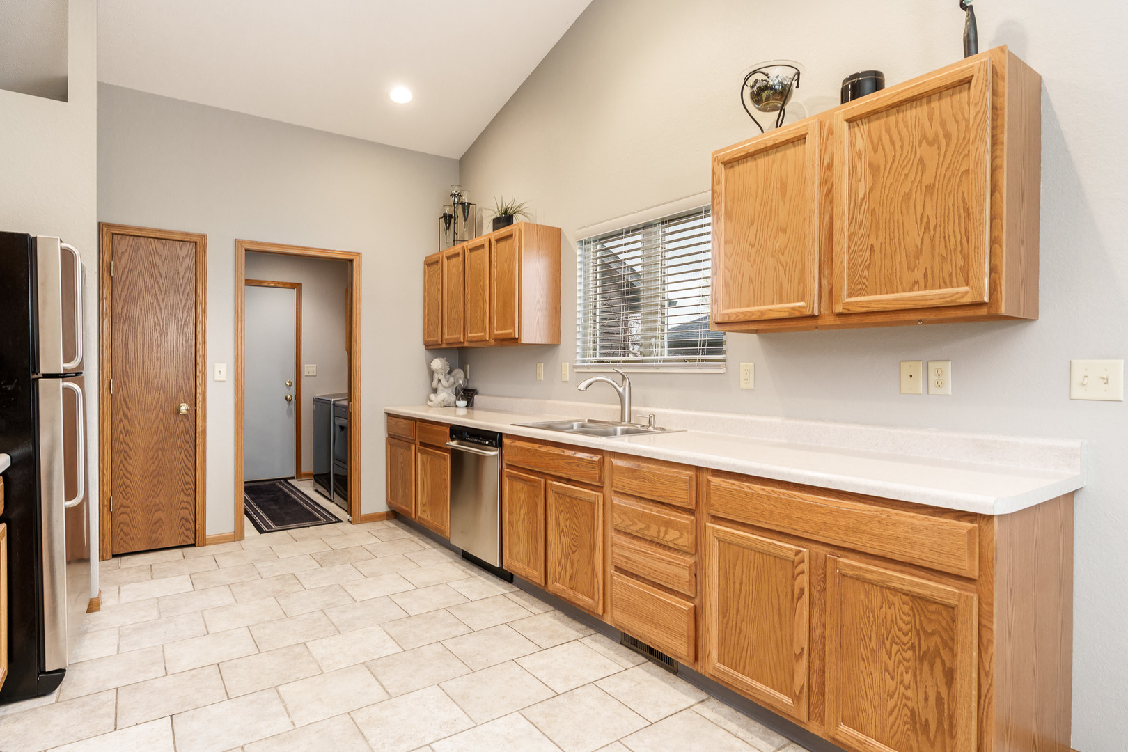 6465 Corina's Curve Rockford, IL 61103 - Photo 20 of 48 a kitchen with stainless steel appliances granite countertop a sink and cabinets