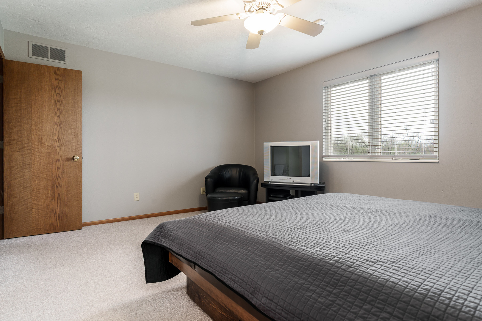 6465 Corina's Curve Rockford, IL 61103 - Photo 25 of 48 a bedroom with a bed and a chandelier