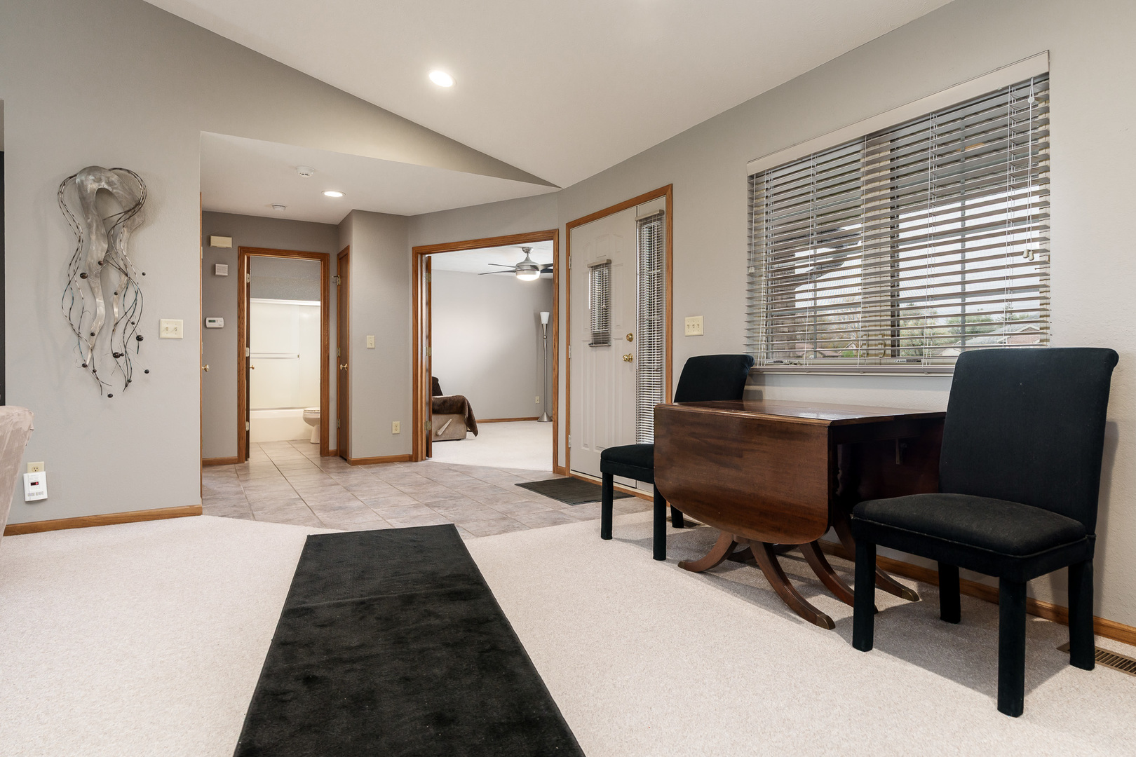 6465 Corina's Curve Rockford, IL 61103 - Photo 7 of 48 a living room with furniture and a chair