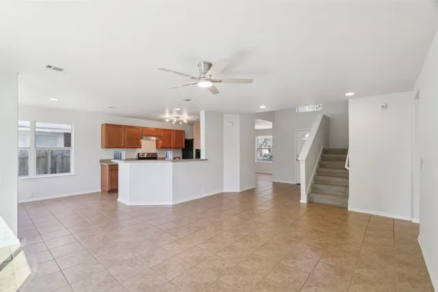 a view of a kitchen with a sink and a kitchen view