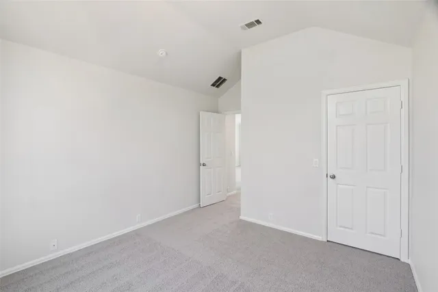 an empty room with a empty space and window