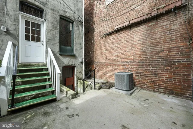 a view of a patio with table and chairs