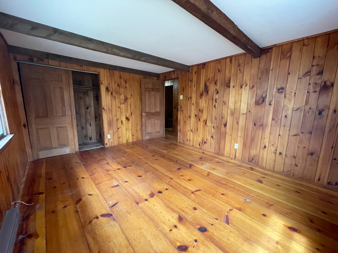 42 Marthas Road Edgartown, MA 02539 - Photo 11 of 18 a view of a room with wooden floor and large window